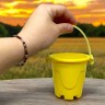 Пісочний набір (відерце, лопатка, 3 формочки для піску) жовтий